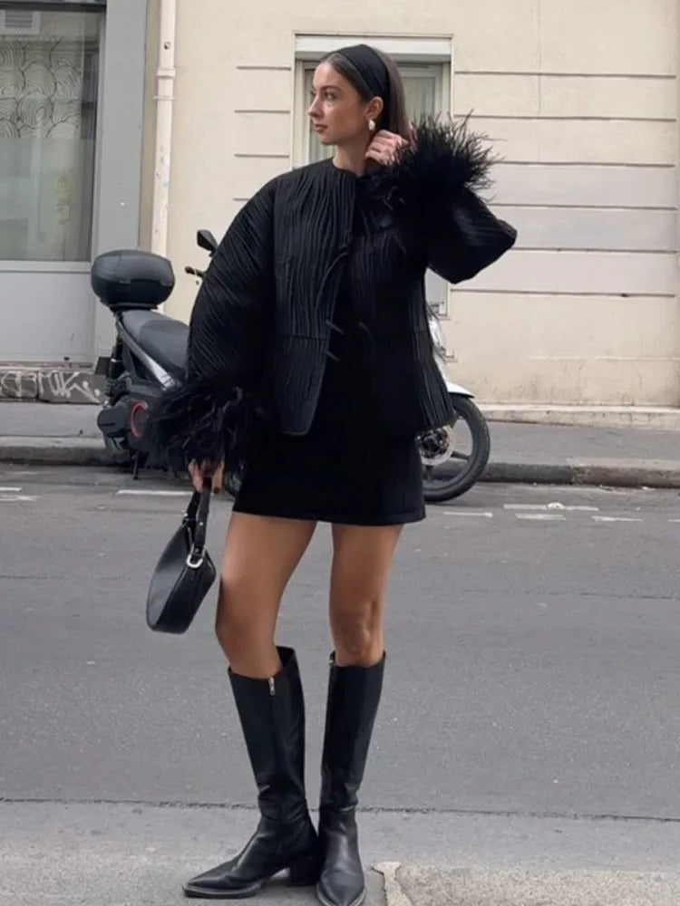 Abrigo ssandra con plumas