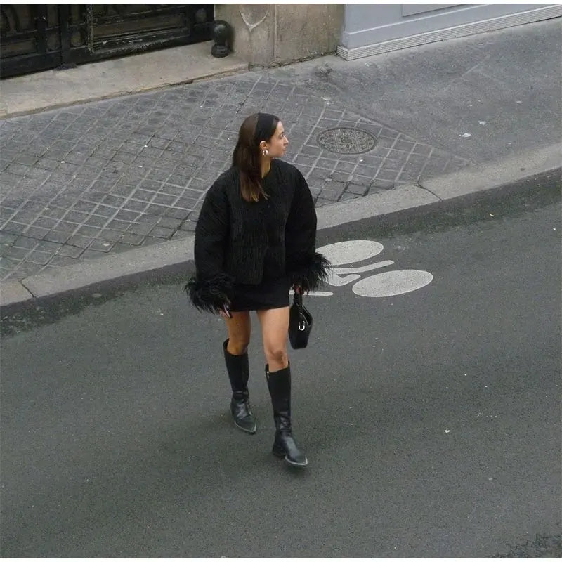 Abrigo ssandra con plumas